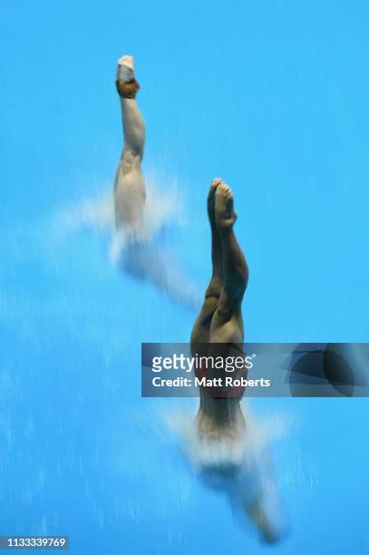 Hao Yang and Yani Chang of China compete during the Mixed 3m Synchro Springboard Final on day three of the FINA Diving World Cup Sagamihara at...