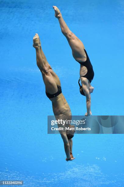 Thomas Daley and Grace Reid of Great Britain compete during the Mixed 3m Synchro Springboard Final on day three of the FINA Diving World Cup...