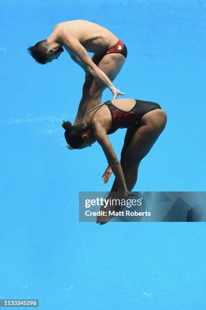 Jennifer Abel and Francois Imbeau-Dulac of Canada compete during the Mixed 3m Synchro Springboard Final on day three of the FINA Diving World Cup...