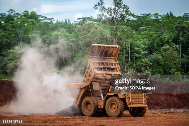 Heavy trucks seen working at PT Vale Indonesia's nickel mining area. Nickel mining by the PT Vale Indonesia, a nickel plant in Soroako, South...