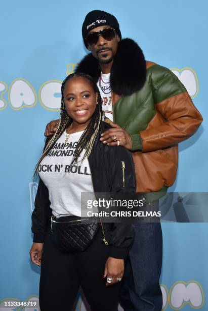 Rapper,actor Snoop Dogg and his wife Shante Taylor arrive for the Los Angeles premiere of "The Beach Bum" at the Arclight cinemas on March 28, 2019...