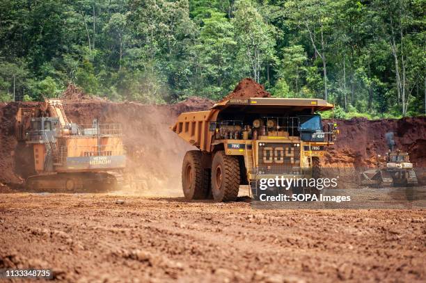 Heavy trucks seen working at the nickel mining area. Nickel mining by the PT Vale Indonesia, a nickel plant in Soroako, South Sulawesi, Indonesia. A...