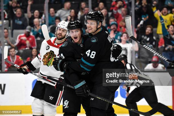 Gustav Nyquist and Tomas Hertl of the San Jose Sharks celebrate a goal against the Chicago Blackhawks at SAP Center on March 28, 2019 in San Jose,...