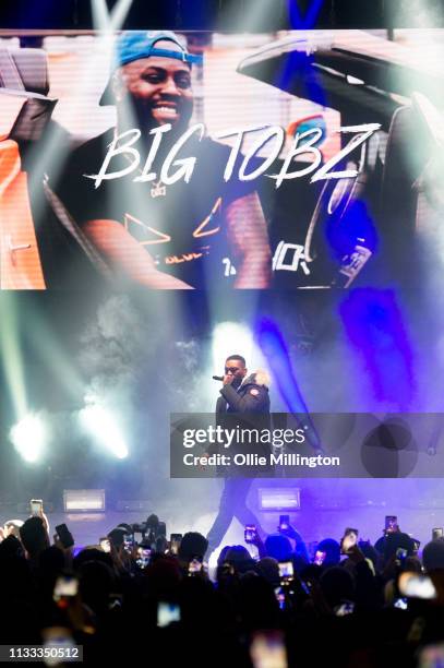 Big Tobz performs on stage during GRM Daily Presents The Rated Legend Tribute Show In Memory Of Cadet at Brixton Academy on March 2, 2019 in London,...