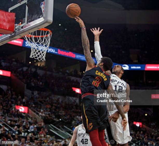 Marquese Chriss of the Cleveland Cavaliers scores past LaMarcus Aldridge of the San Antonio Spursat AT&T Center on March 28, 2019 in San Antonio,...