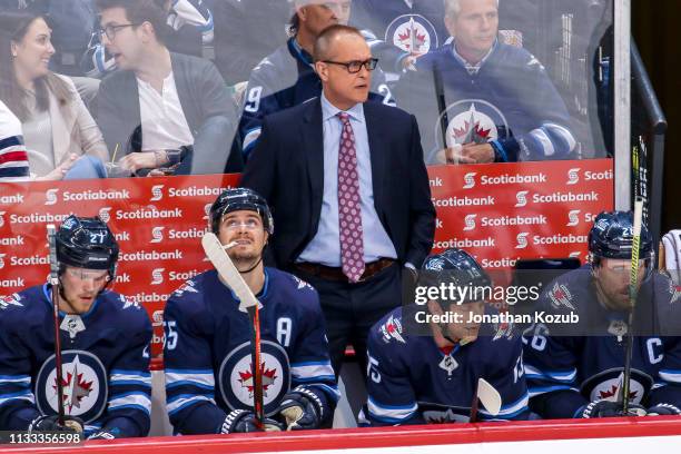 Head Coach Paul Maurice of the Winnipeg Jets looks on from the bench during third period action against the New York Islanders at the Bell MTS Place...