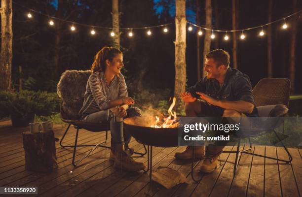 love summer night - sitting by fireplace stock pictures, royalty-free photos & images