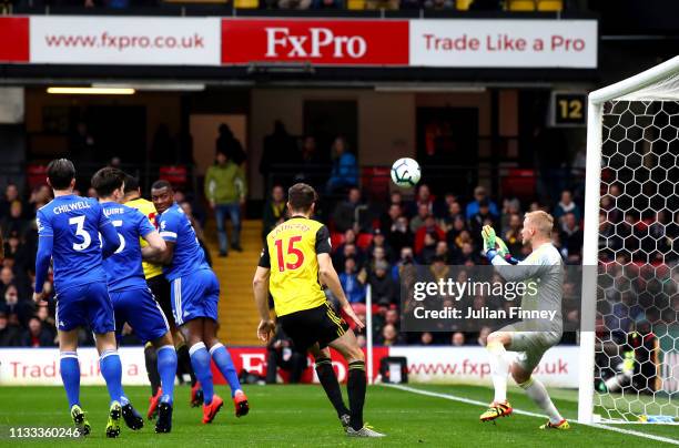 Troy Deeney of Watford scores his sides first goal during the Premier League match between Watford FC and Leicester City at Vicarage Road on March...