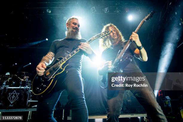 Björn Gelotte and former Megadeth member Chris Broderick on stage with members of In Flames as they perform perform with Within Temptation at...