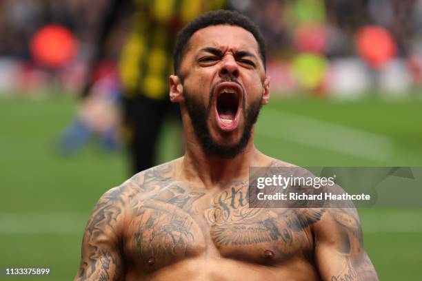 Andre Gray of Watford celberates after scoring his sides second goal during the Premier League match between Watford FC and Leicester City at...