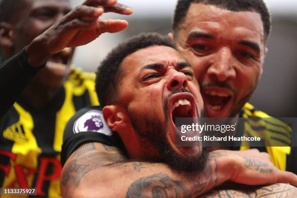 Andre Gray of Watford celberates after scoring his sides second goal during the Premier League match between Watford FC and Leicester City at...