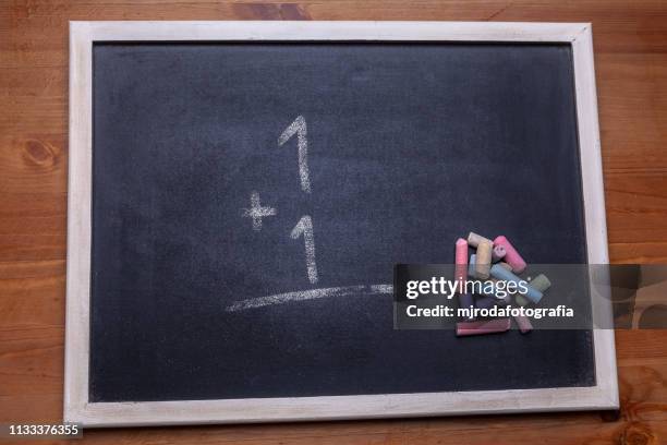 blackboard. there are numbers on the board. - niñez stock-fotos und bilder