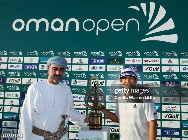 His Highness Sayyid Taimur bin Assad al Said presents Kurt Kitayama of USA with the winners trophy after winning the Oman Golf Classic at Al Mouj...