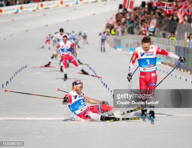 Sjur Roethe of Norway beats Martin Johnsrud Sundby of Norway to the line for third place in the Men's 50km Cross Country mass start during the FIS...