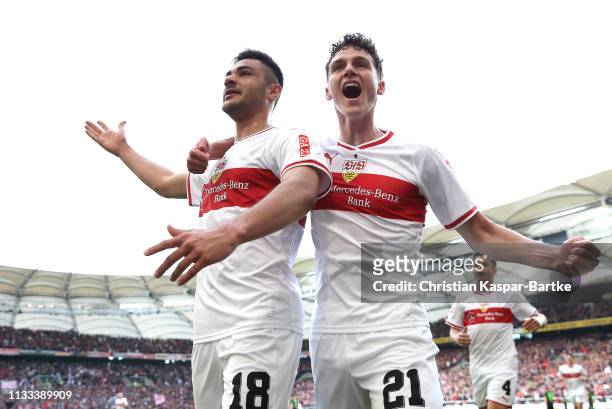 Ozan Kabak of VfB Stuttgart celebrates scoring his sides third goal with Benjamin Pavard during the Bundesliga match between VfB Stuttgart and...