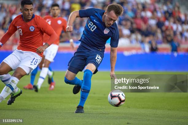 United States forward Corey Baird battles with Chile defender Gonzalo Jara in game action during a friendly International match between Chile and the...