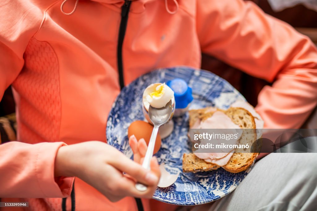 Young Women eating Breakfast before going on a run