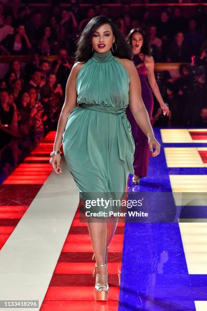 Model walks the runway during the Tommy Hilfiger TOMMYNOW Spring 2019 : TommyXZendaya Premieres at Theatre des Champs-Elysees on March 02, 2019 in...