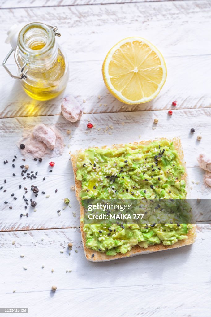 Smashed avocado toast with pepper chilli, sesame seeds, olive oil, Himalayan salt and fresh lemon juice.