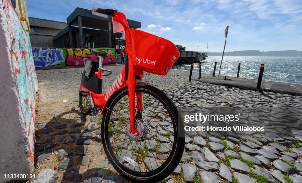 Parked Uber-Jump electric bicycle on the Ciclovia Lisboa Cidade by Tagus Ricer in Cais Gás on March 03, 2019 in Lisbon, Portugal. Starting February...