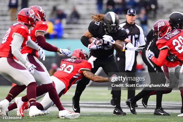 Derron Smith of the San Antonio Commanders attempts to tackle Trent Richardson of the Birmingham Iron during the first half in an Alliance of...