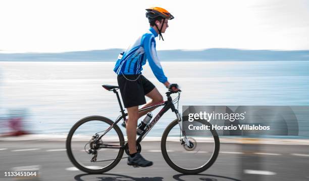 Man rides a Berg Trailrock 1.3 bicycle along the Ciclovia Lisboa Cidade by Tagus River in Cais Gás on March 03, 2019 in Lisbon, Portugal. The city...