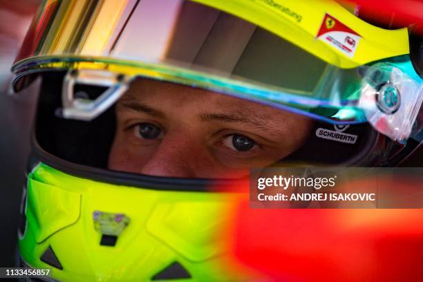 Mick Schumacher, son of seven-times world champion Michael, prepares to drive his Formula 2 PREMA Racing car out of the pit lane ahead of the Formula...