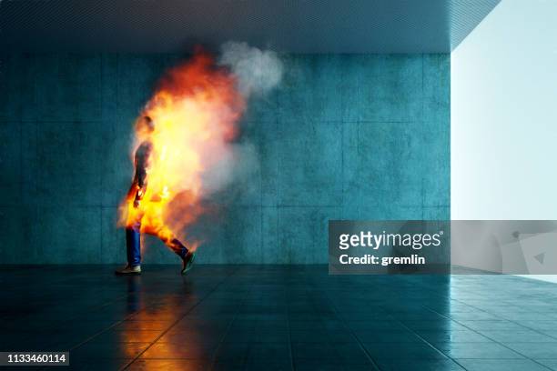 burning businessman in the office - burning city stock pictures, royalty-free photos & images