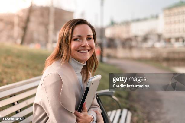 woman studying on her laptop in the park - school scandinavia stock pictures, royalty-free photos & images