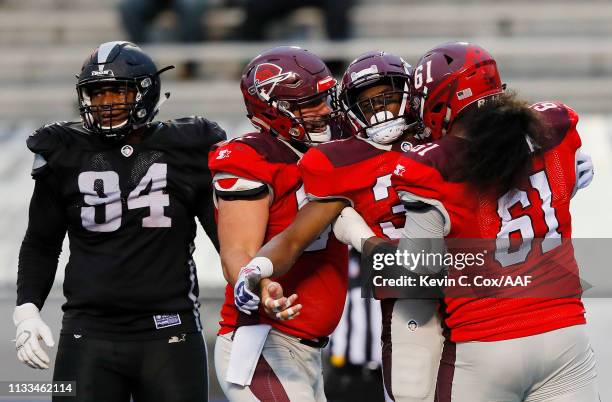 Trey Williams of the San Antonio Commanders celebrates with teammates after rushing for a 12-yard touchdown during the third quarter against the...
