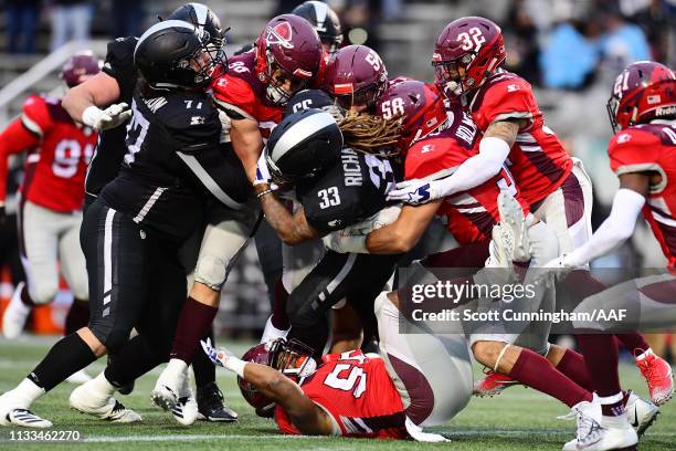 The San Antonio Commanders defense attempts to tackle Trent Richardson of the Birmingham Iron during the second half in an Alliance of American...