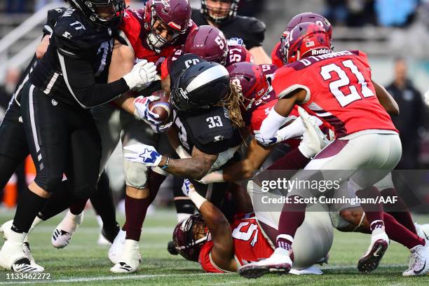 The San Antonio Commanders defense attempts to tackle Trent Richardson of the Birmingham Iron during the second half in an Alliance of American...