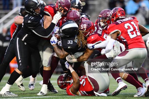 The San Antonio Commanders defense attempts to tackle Trent Richardson of the Birmingham Iron during the second half in an Alliance of American...