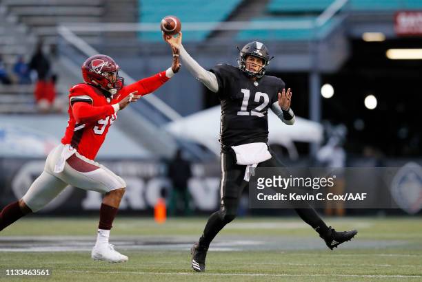 Deion Barnes of the San Antonio Commanders attempts to block a pass by Luis Perez of the Birmingham Iron during the second half in an Alliance of...