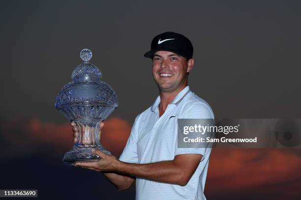 Keith Mitchell poses with the trophy after winning the Honda Classic at PGA National Resort and Spa on March 03, 2019 in Palm Beach Gardens, Florida.