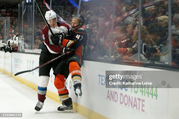 Nikita Zadorov of the Colorado Avalanche checks Hampus Lindholm of the Anaheim Ducks during the third period at Honda Center on March 03, 2019 in...