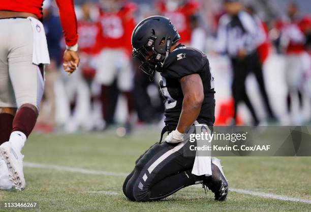 Brandon Ross of the Birmingham Iron reacts after fumbling the ball during the second half against the San Antonio Commanders in an Alliance of...