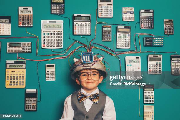 young nerd boy with calculator invention - retro calculator stock pictures, royalty-free photos & images