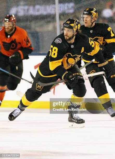 Kris Letang of the Pittsburgh Penguins skates against the Philadelphia Flyers at the 2019 Coors Light NHL Stadium Series on February 23, 2019 at...