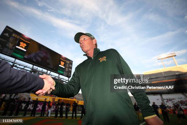 Head coach Rick Neuheisel of the Arizona Hotshots greets emergency responders before the start of the Alliance of American Football game against the...