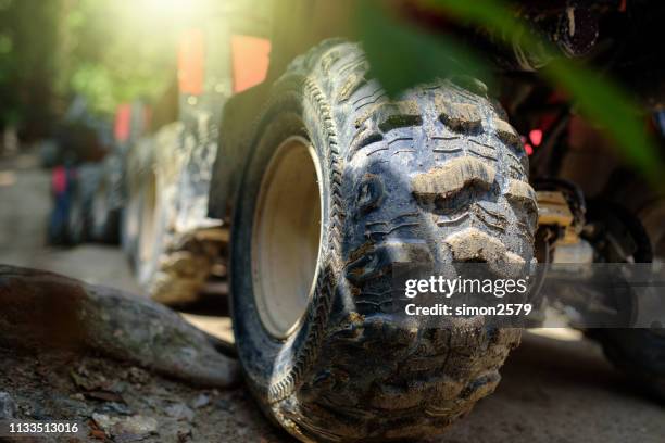 closed up on atv quad bike in the rainforest - quadbike stock pictures, royalty-free photos & images