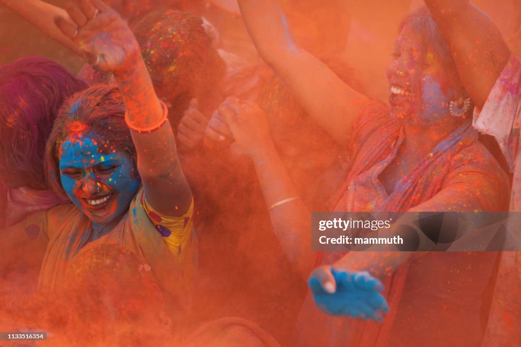 Young people celebrating holi festival in India