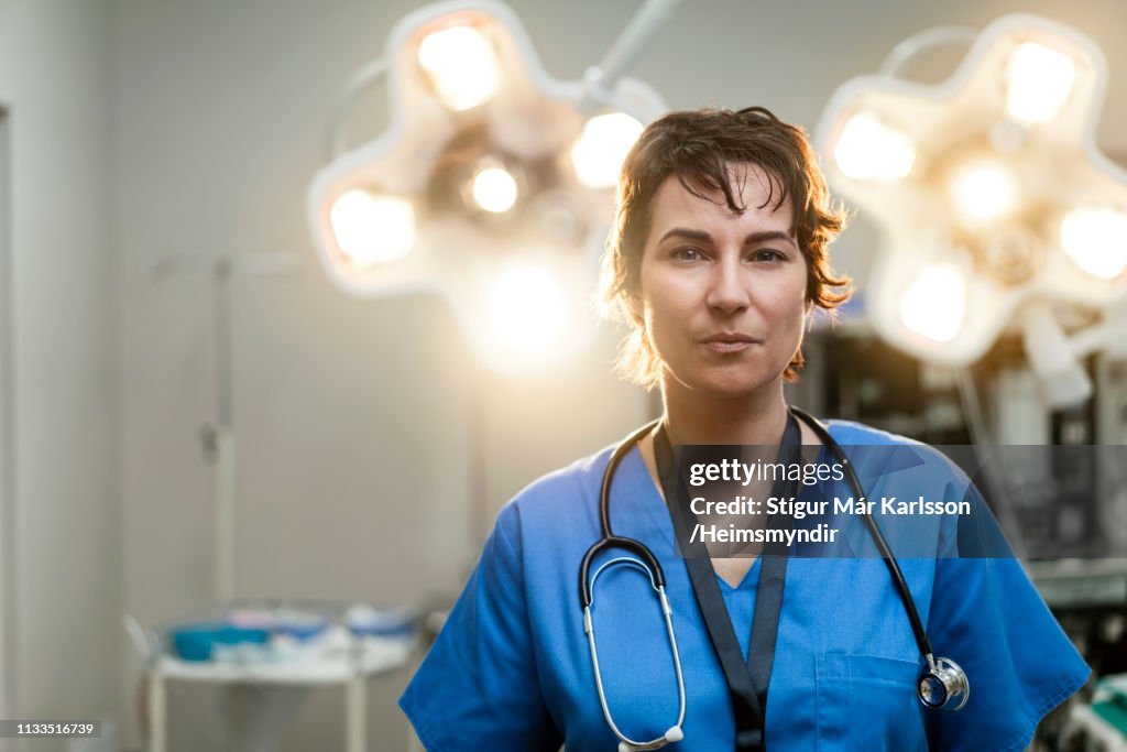 Portrait of confident female surgeon in hospital