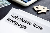 Adjustable Rate Mortgage ARM documents on a table.