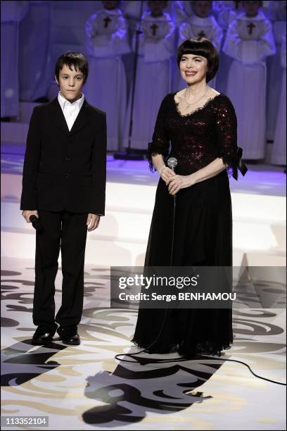 Mireille Mathieu And Tina Arena On The 100 Th Christmas Of 'Les Petits Chanteurs A La Croix De Bois' Tv Show In Paris, France On December 04, 2006 -...