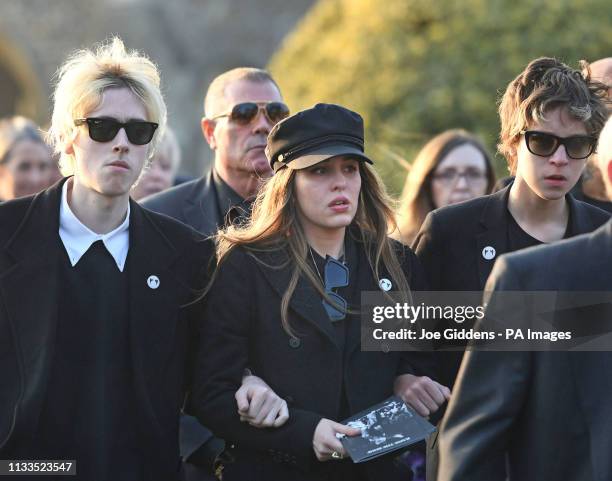 Gene Gallagher, Rachel Howlett and Ace Howlett after the funeral of Keith Flint at St Mary's Church in Bocking, Essex.