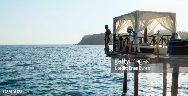 five stars luxury hotel's pavilion by the sea panoramic view - getting away from it all - upper class stock pictures, royalty-free photos & images