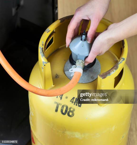 lpg gas bottle, butane gas cylinders - lpg-installation stock pictures, royalty-free photos & images
