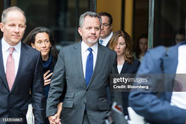 Bill McGlashan, a former top executive at TPG Growth LLC who was fired after he was charged, center, exits federal court in Boston, Massachusetts,...