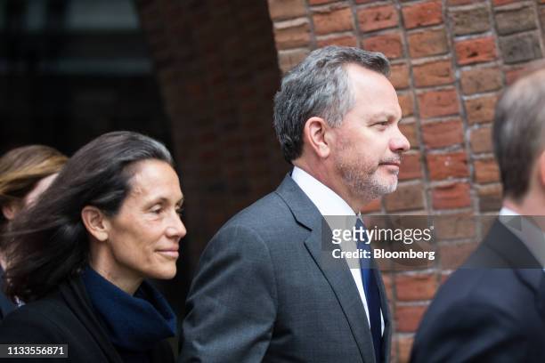 Bill McGlashan, a former top executive at TPG Growth LLC who was fired after he was charged, center, exits federal court in Boston, Massachusetts,...